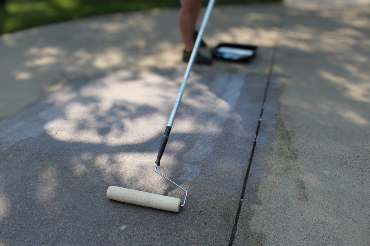 applying sealer on concrete driveways